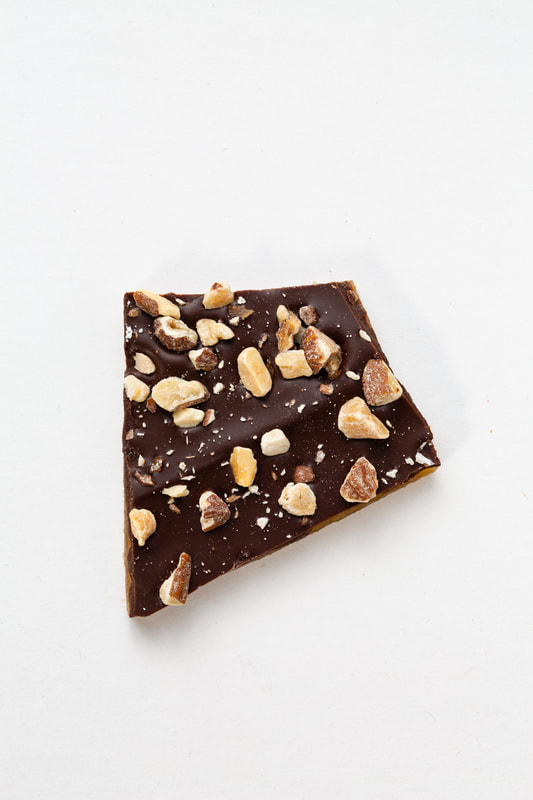 Butter toffee topped with dark chocolate and dry roasted almonds